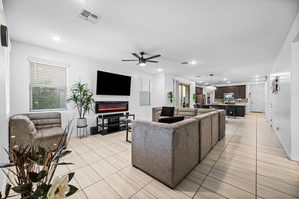 Expansive open-concept living area connecting the great room, dining space, and kitchen. The functional layout creates an inviting atmosphere perfect for gatherings and daily life.