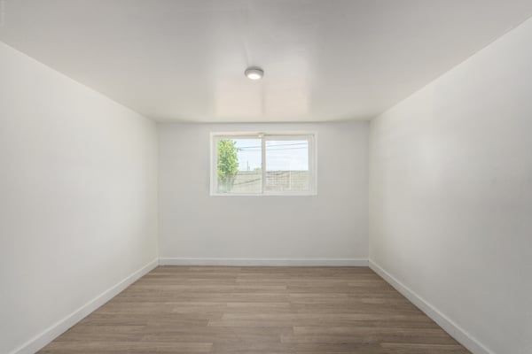Bright bonus room with updated flooring and flexible layout perfect for a game room, office, exercise room, creative studio, or additional family living space in Mesa.