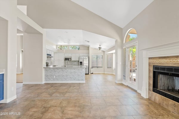 Enjoy an inviting open floor plan where the updated kitchen overlooks the spacious family room with a cozy fireplace and vaulted ceilings. Natural light and backyard access complete this comfortable living space.