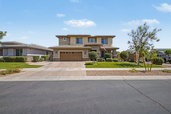 Attractive two-story residence featuring professional landscaping, stone accents, paver driveway, and a spacious 3-car garage. A beautifully maintained home offering exceptional curb appeal in Mesa.