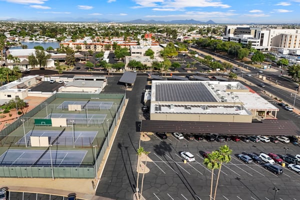 Aerial image showcases nearby tennis courts, recreation facilities, and surrounding neighborhood amenities, adding convenience and outdoor enjoyment to this Sun City location.