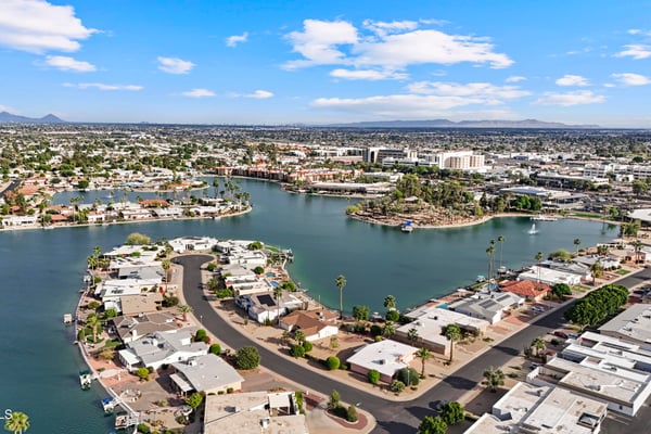 Panoramic aerial captures the beautiful lakes, waterfront homes, recreation facilities, and surrounding neighborhood. Discover the exceptional scenery and outdoor lifestyle available in Sun City.