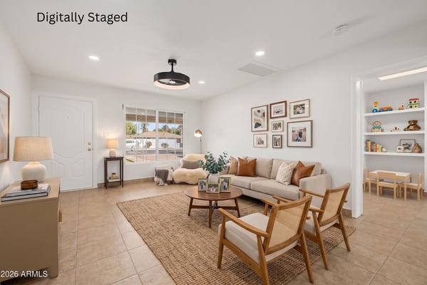 Digitally staged rendering demonstrating the possibilities of this spacious living room with modern furnishings, warm accents, tile flooring, and an inviting open layout in this Phoenix home.