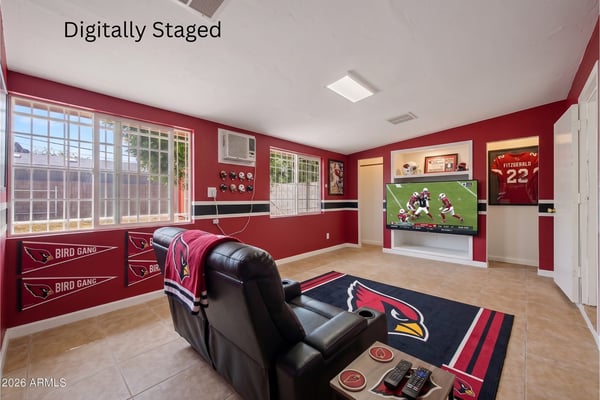 Digitally staged rendering presents the expansive flex room as a stylish entertainment lounge with theater seating and media center. This visualization demonstrates the many possibilities of this versatile space in the Phoenix home.