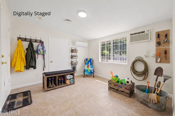 Digitally staged visualization transforms the bonus room into an organized mudroom with practical storage, seating, and everyday organization. This concept showcases another functional use for this flexible Phoenix home.