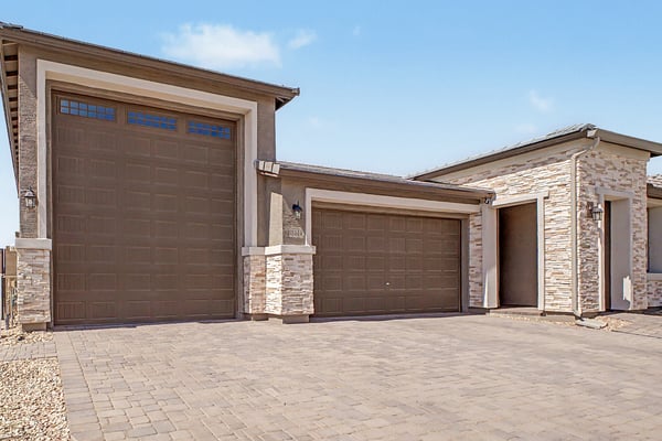 Oversized RV garage and attached 2-car garage provide incredible storage, convenience, and flexibility. Modern stone accents and premium finishes complete this impressive exterior.