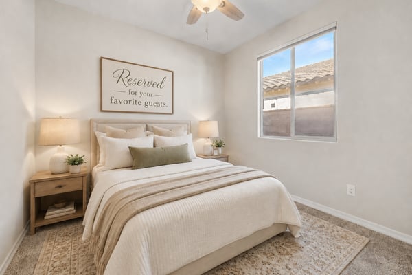Virtually Staged Secondary bedroom with plush carpet, ceiling fan, and abundant natural light. The clean, neutral design provides a move-in-ready space suitable for guests or everyday living.