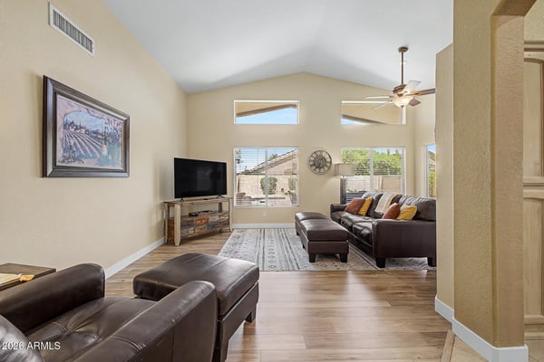 Enjoy bright, open living with vaulted ceilings, expansive windows, and updated wood-look flooring. This versatile great room provides plenty of space for entertaining or relaxing after a busy day.