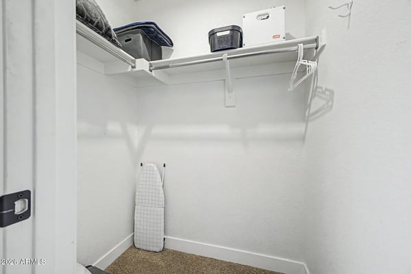 A spacious storage closet with built-in shelving provides the perfect place to organize linens, luggage, seasonal d cor, and household items, adding valuable functionality to this Goodyear rental home.
