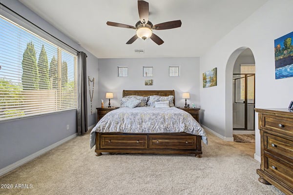 Enjoy comfort and privacy in the spacious owner's suite featuring large windows, soft carpeting, and generous room for relaxing. A tranquil retreat designed for everyday comfort.