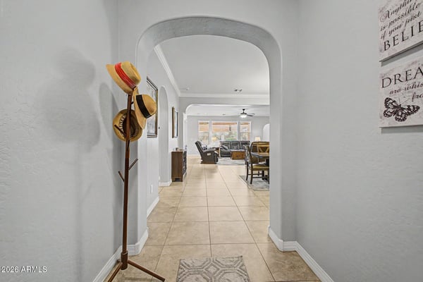 Elegant archways, spacious hallways, and attractive finishes create a warm and inviting entrance. The open design provides a welcoming introduction to the home's comfortable living spaces.