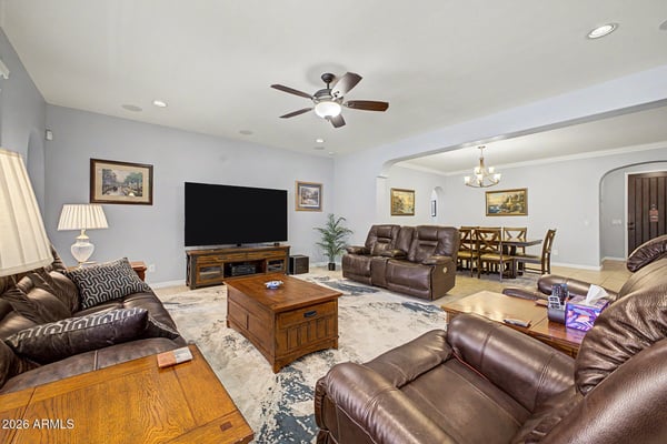 Enjoy expansive open living with connected dining and family spaces that make entertaining effortless. Neutral finishes, tile flooring, and spacious gathering areas enhance the home's comfortable layout.