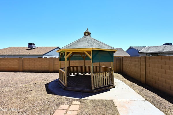 Attractive gazebo creates a welcoming outdoor retreat within the spacious backyard, offering a relaxing setting for entertaining or enjoying the Arizona sunshine.