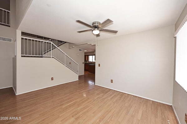 Spacious dining area offers updated flooring and an open design that flows effortlessly into the home's main living spaces, perfect for everyday dining and entertaining.