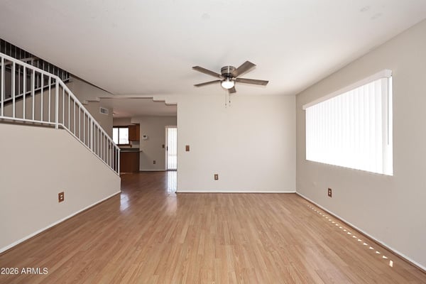 Open dining room features updated flooring, generous space for entertaining, and seamless flow into the home's main living areas for comfortable everyday living.