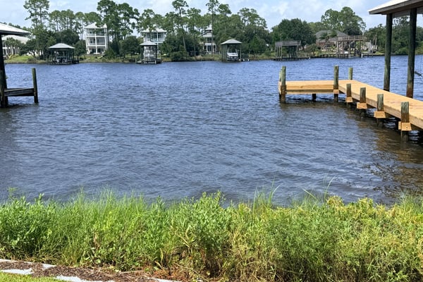 Waterfront property featuring private dock access, offering stunning views and opportunities for outdoor activities.