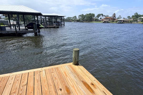 Waterfront property featuring a spacious dock, perfect for boating and enjoying scenic views.