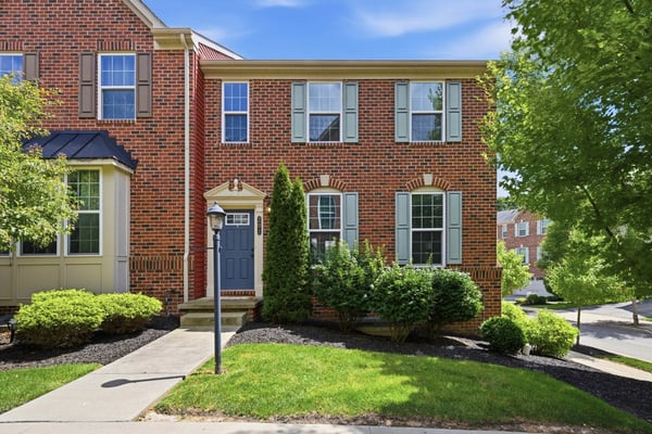 This spacious end-unit townhome features attractive brickwork, abundant natural light, and well-maintained landscaping.