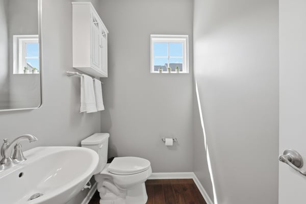 The powder room is tucked away for privacy.