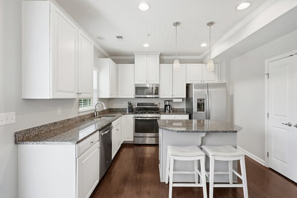 Modern kitchen featuring granite countertops, stainless steel appliances, and a functional layout for cooking and entertaining.