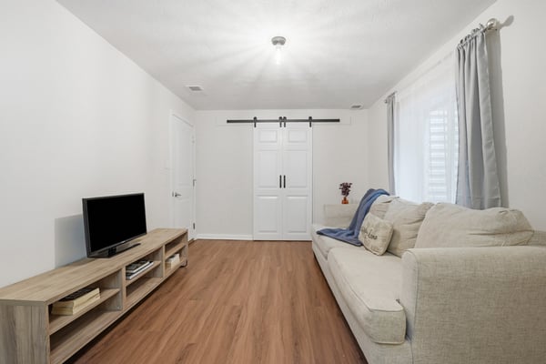 Bright living area featuring modern finishes, ample natural light, and a functional layout for relaxation and entertainment.