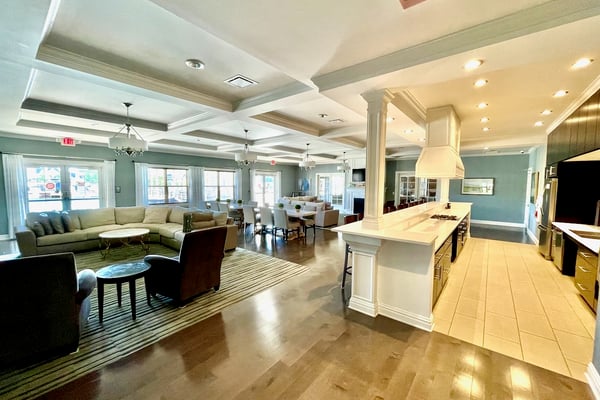 Spacious open-concept living area featuring modern finishes, ample natural light, and inviting social spaces for gatherings.