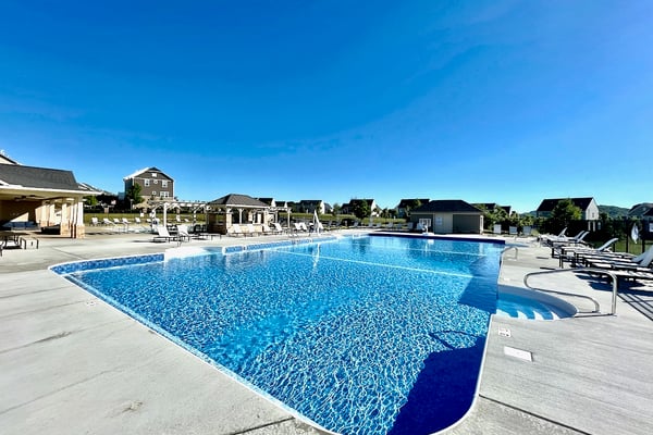 Experience leisure living with this expansive pool area, perfect for relaxation and social gatherings.