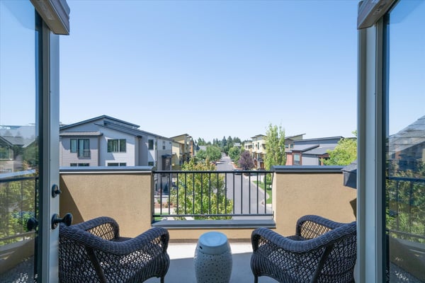 Double French doors open to this private deck that overlooks the surrounding neighborhood and takes in the the gorgeous Oregon sunsets.