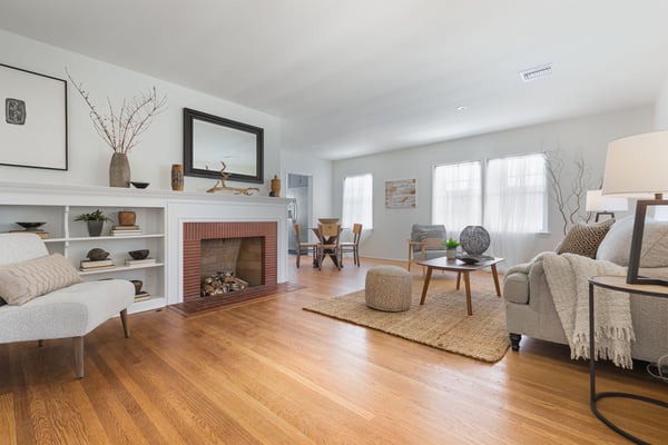 Living room with fireplace, built in shelving