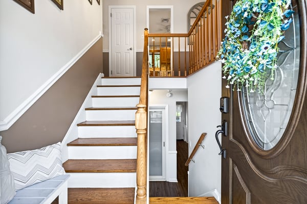 Welcoming entry with staircase up to main rooms.