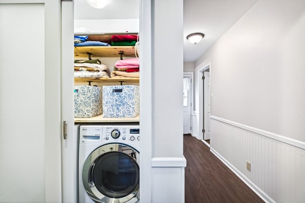 Efficient laundry closet with storage.