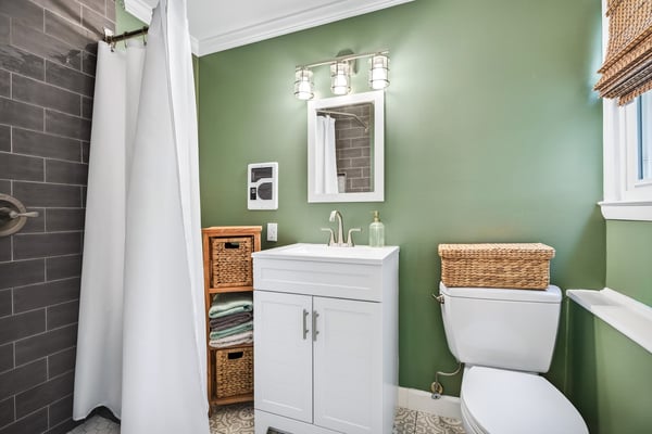 Chic bathroom with calming green hues.