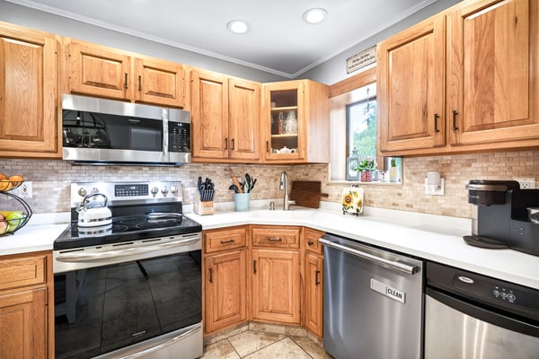 Efficient kitchen with SS appliances.