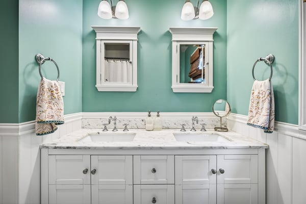 Dual sinks and medicine cabinets.