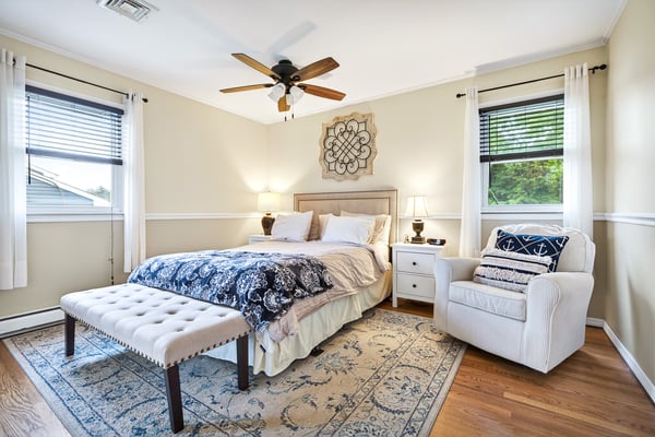 Serene primary bedroom with natural light.