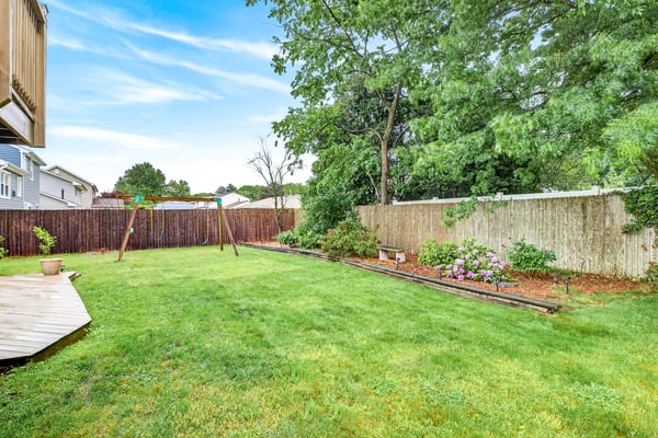 Backyard oasis with flower beds.