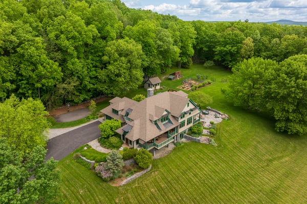 Nestled among lush greenery, this spacious home offers a tranquil retreat with expansive outdoor space and scenic views.