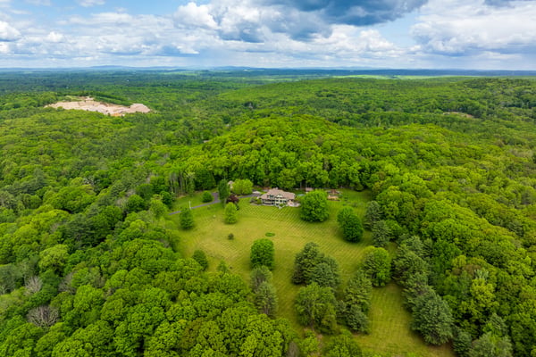 Spacious acreage surrounded by lush greenery, ideal for a private retreat or development opportunity.
