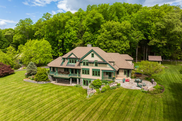 Spacious home nestled in lush greenery, featuring expansive outdoor areas and scenic views for relaxation.