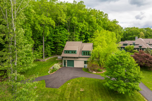 Nestled among lush greenery, this home offers a private retreat with ample outdoor space and tranquility.