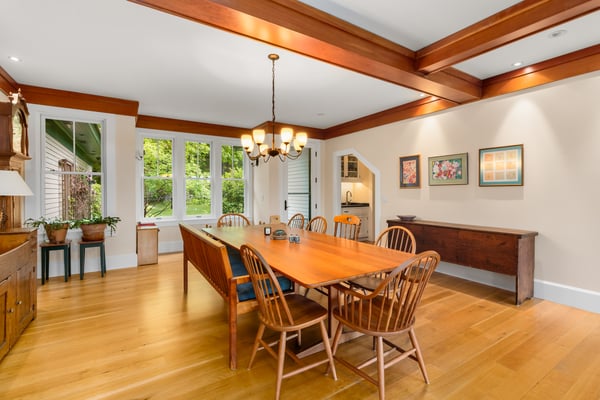 Spacious dining area featuring natural light, custom woodwork, and a welcoming atmosphere for gatherings.
