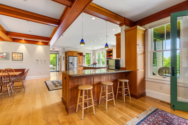 Bright and inviting kitchen features a spacious island, perfect for casual dining and entertaining.