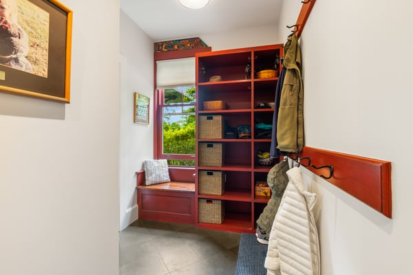 Inviting entryway featuring abundant storage and a cozy bench, perfect for daily organization and ease of access.