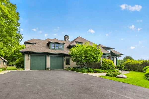Discover this beautifully landscaped home featuring ample parking and scenic views, perfect for outdoor enthusiasts.