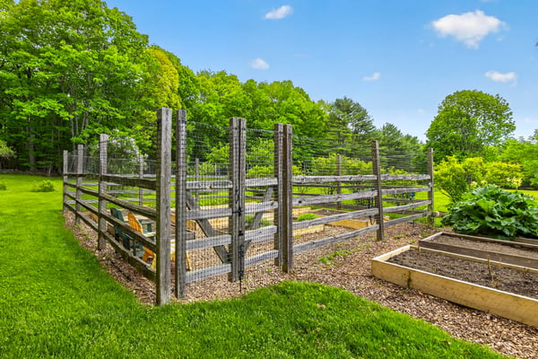 Discover a well-maintained garden area, perfect for cultivating fresh vegetables and enjoying outdoor activities.