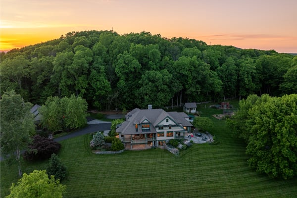 Nestled in lush surroundings, this spacious home offers stunning views and ample outdoor living space.