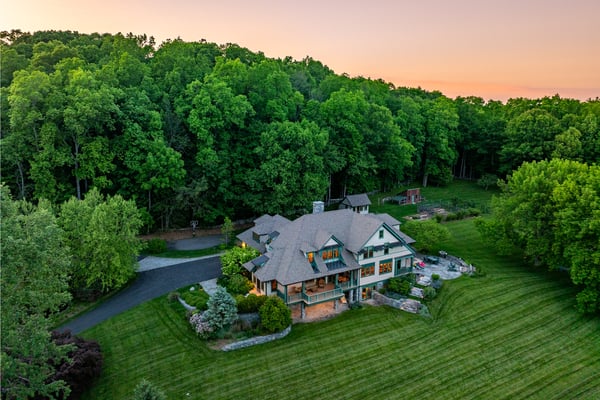 Nestled in lush greenery, this captivating home offers privacy and tranquility, perfect for nature lovers.