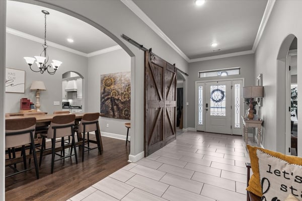 Inviting entryway features an open layout with modern finishes.