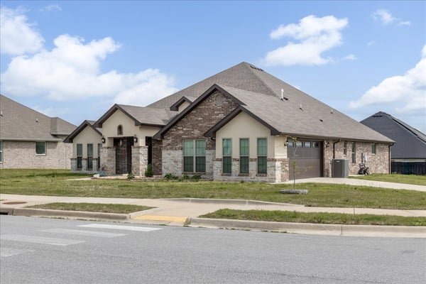 Spacious modern home featuring attractive landscaping and ample natural light in a vibrant neighborhood.