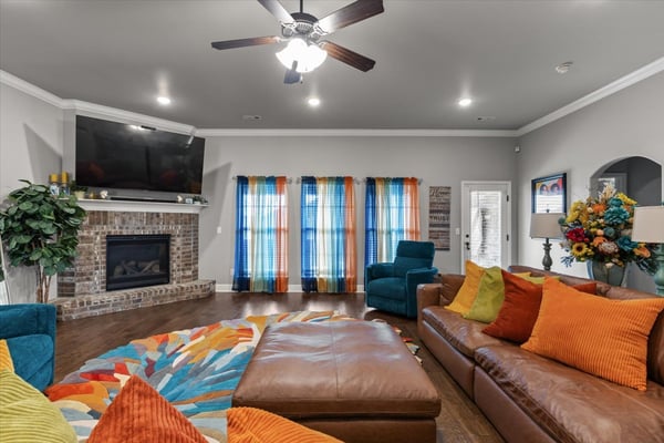 Bright and inviting living room features a fireplace and ample natural light.